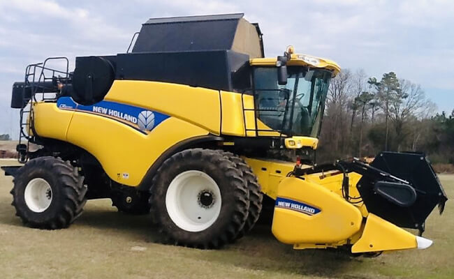 New Holland Combine with Draper Header